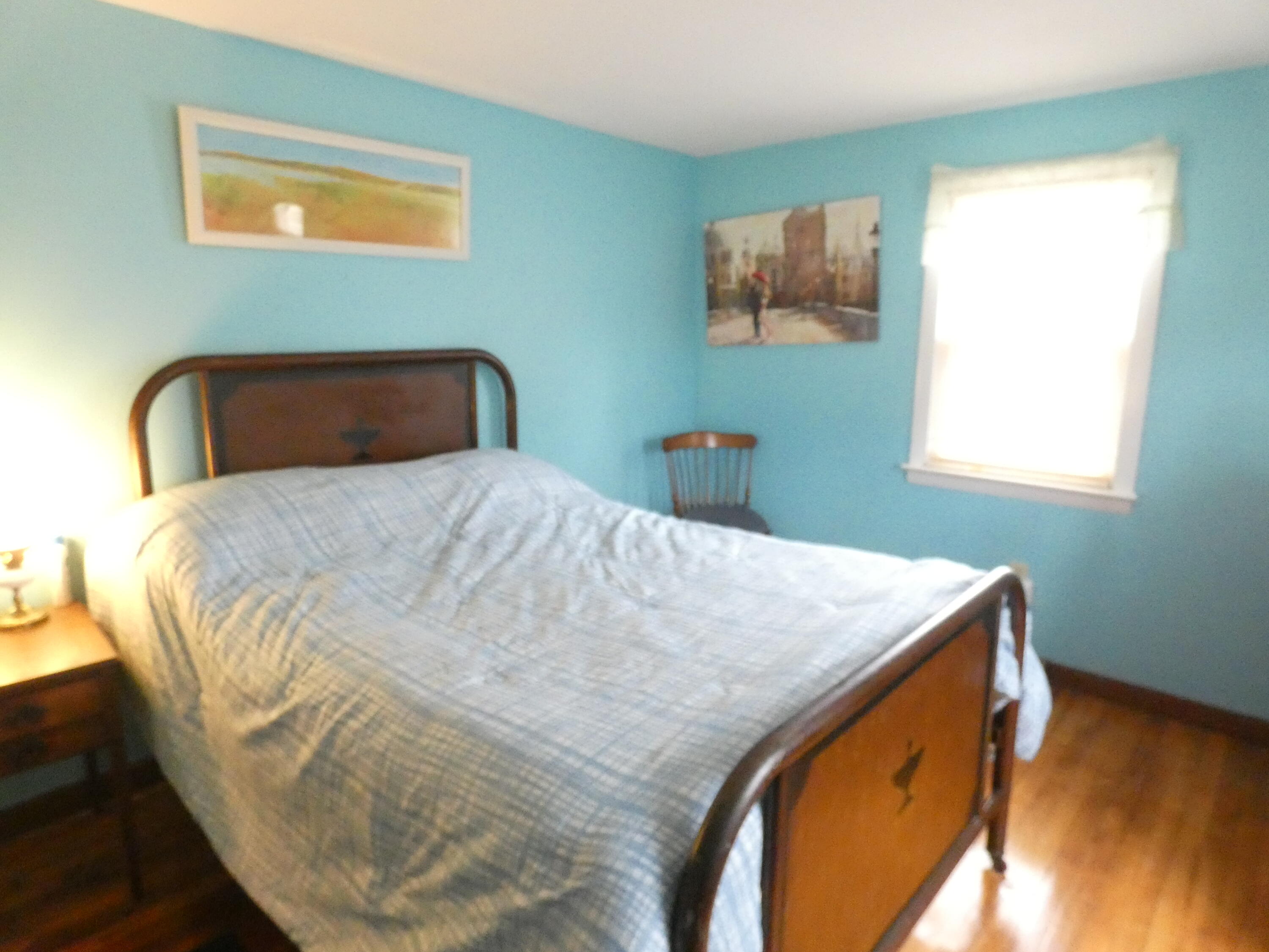 188 Swan River Road West Dennis, MA 02670 - Photo 30 of 39 a bed sitting in a bedroom next to a window