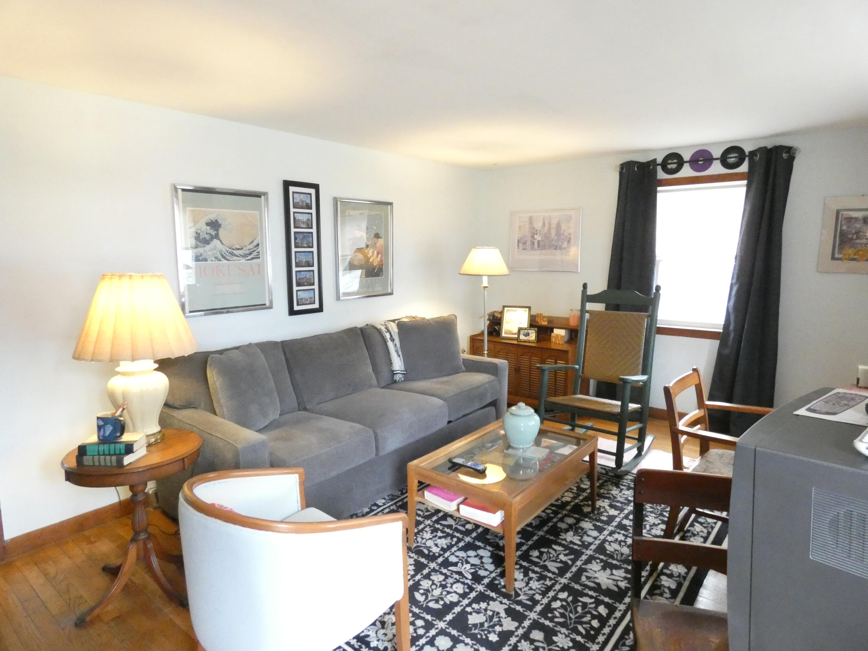 188 Swan River Road West Dennis, MA 02670 - Photo 3 of 39 a living room with furniture and a lamp