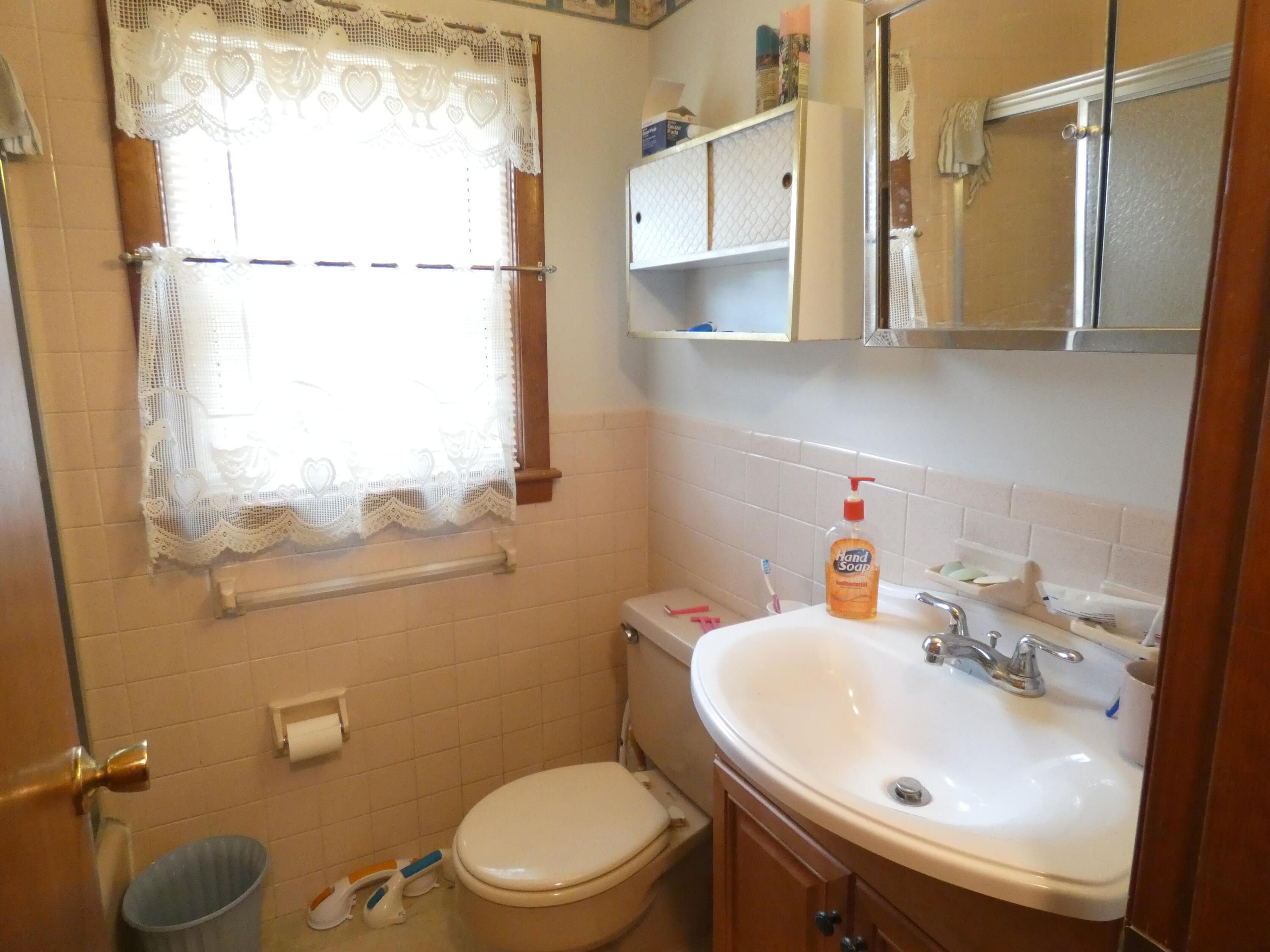 188 Swan River Road West Dennis, MA 02670 - Photo 32 of 39 a bathroom with a sink a toilet and a mirror