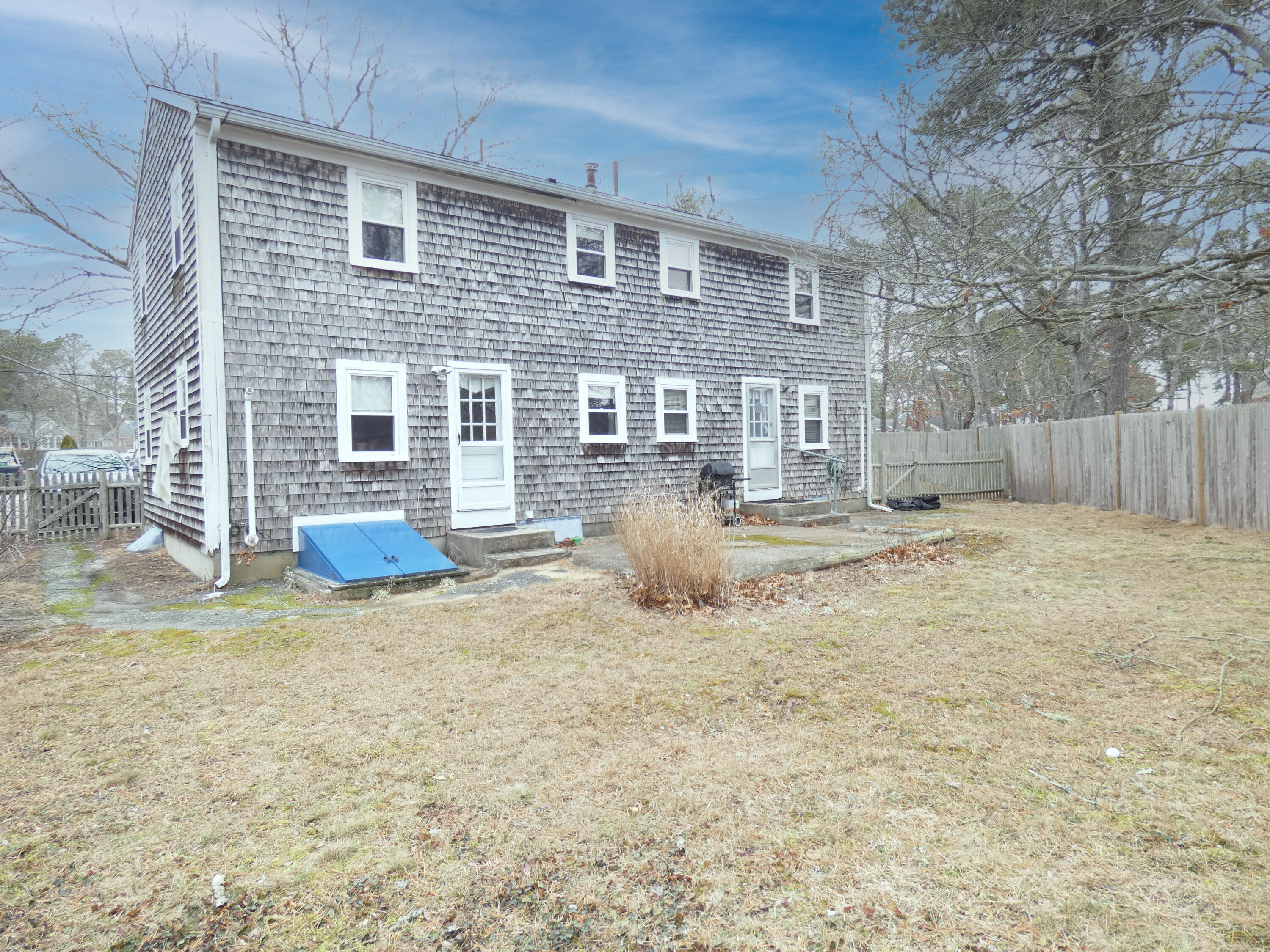 188 Swan River Road West Dennis, MA 02670 - Photo 36 of 39 a view of a house with backyard and a tree