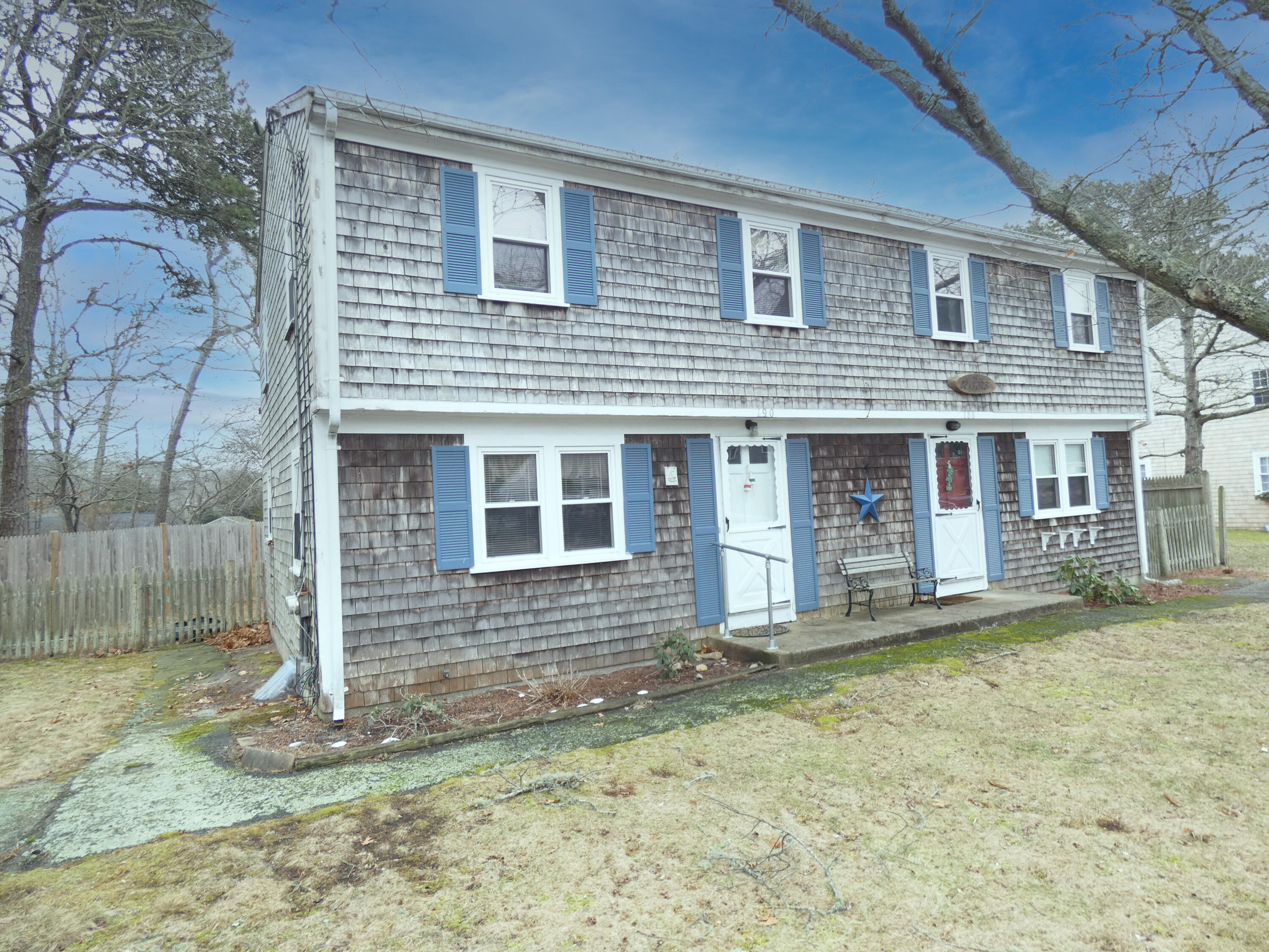 188 Swan River Road West Dennis, MA 02670 - Photo 39 of 39 a front view of a house with a yard