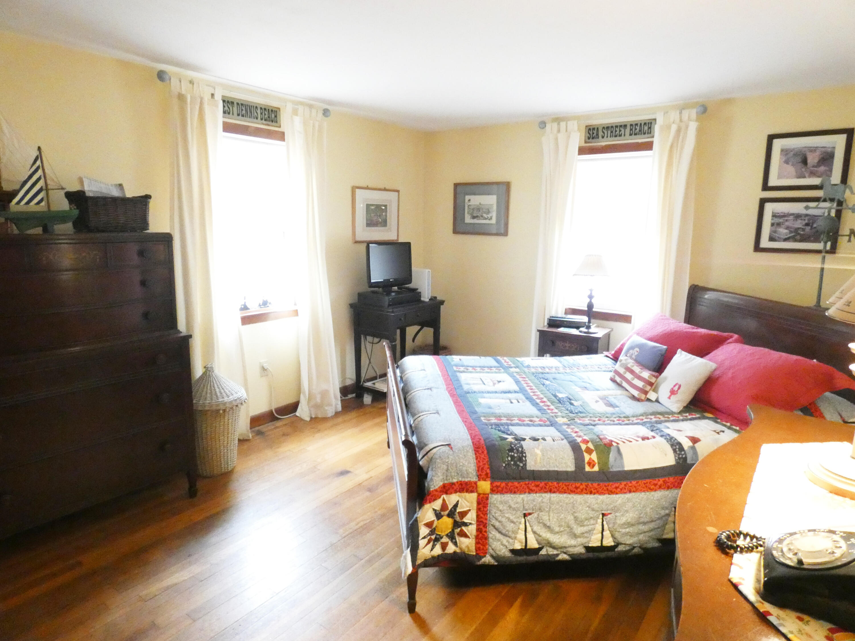 188 Swan River Road West Dennis, MA 02670 - Photo 10 of 39 a bedroom with furniture and a wooden floor