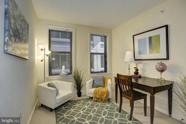 a living room with furniture and windows