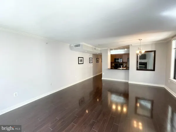 a view of a living room with kitchen