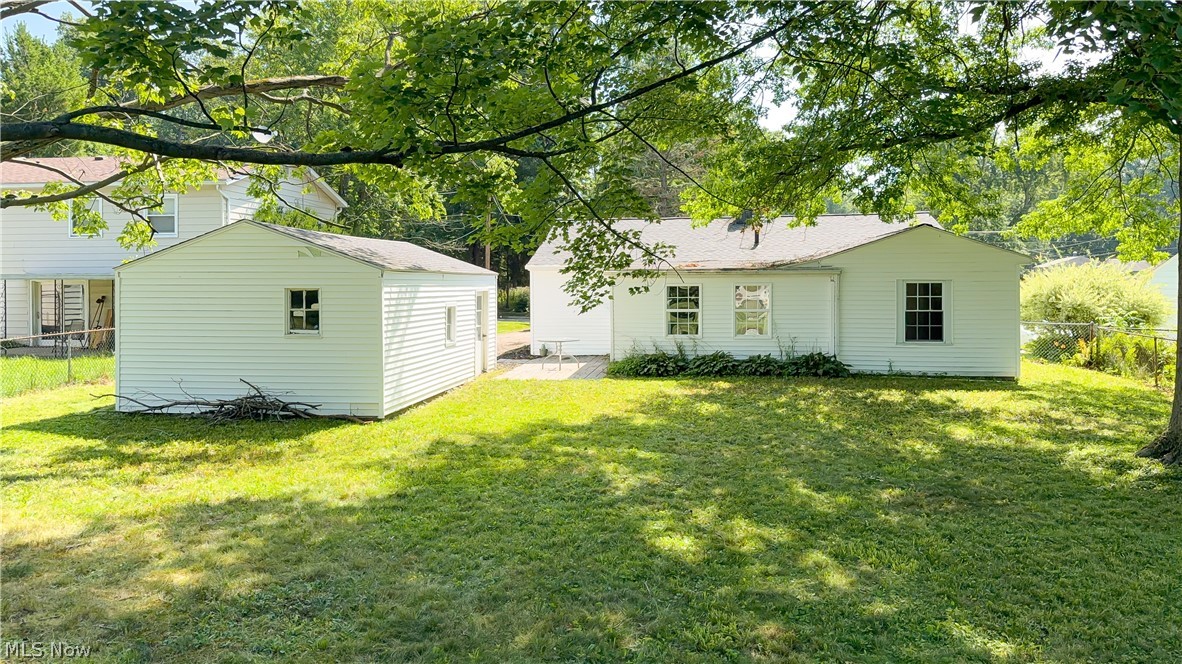 3796 North Santom Road Stow, OH 44224 - Photo 22 of 30 Expansive lawn area featuring a white siding residence and a detached shed