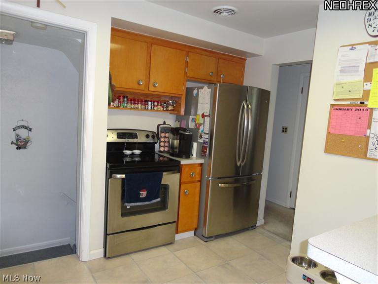 12116 Grannis Road Garfield Heights, OH 44125 - Photo 4 of 14 Stainless steel kitchen appliances included! Newer lamenant floor!