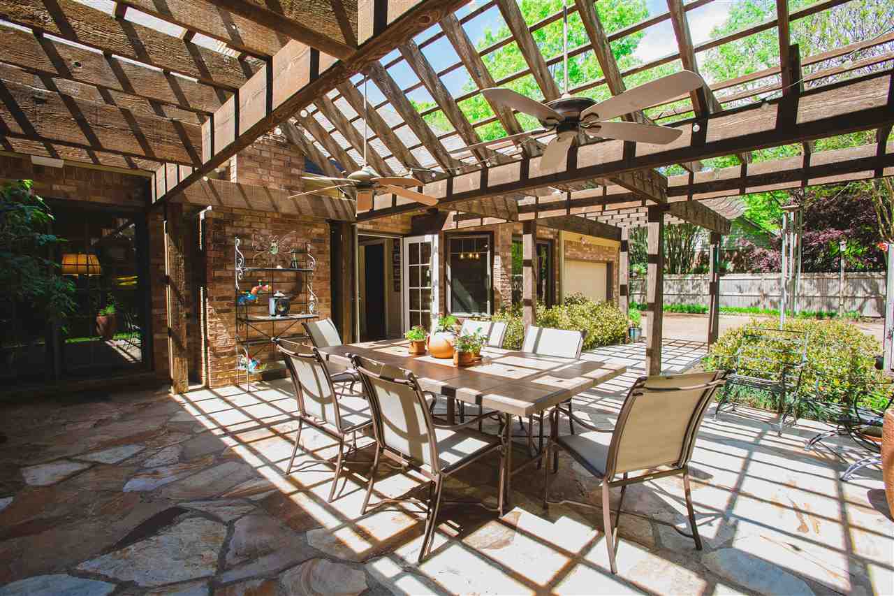 2186 Sunset Road Germantown, TN 38138 - Photo 24 of 25 Who wouldn't want to quarantine here? This gorgeous stone patio with pergola feels like a vacation house.