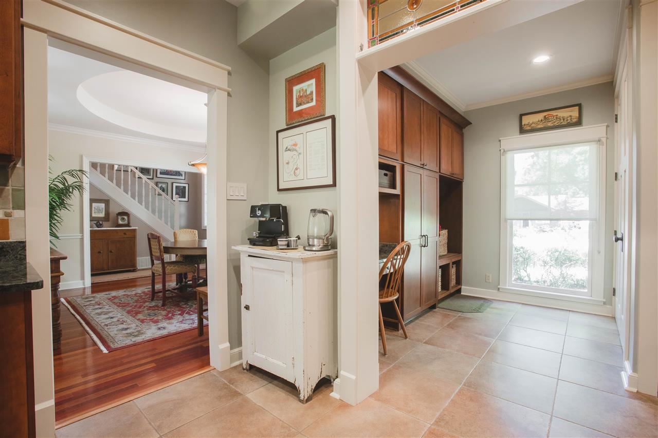 2186 Sunset Road Germantown, TN 38138 - Photo 5 of 25 Coming from the garage and opening into the kitchen, you'll find this fabulous mudroom with desk, locker area, pantry, large laundry closet, broom closet and a half bath.
