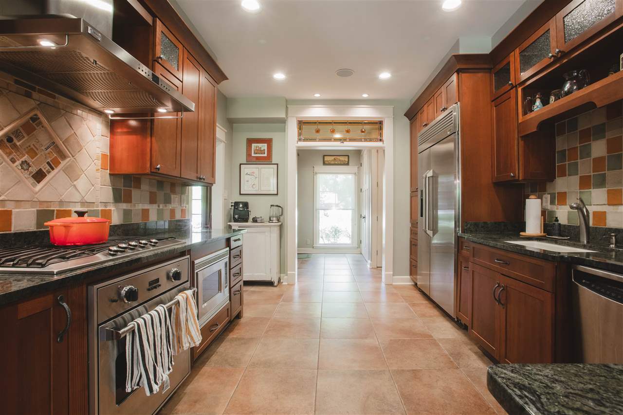 2186 Sunset Road Germantown, TN 38138 - Photo 7 of 25 The kitchen. A true custom chefs kitchen. All the bell and whistles in the cabinetry, loads of counter space, built in under counter microwave and Viking gas cooktop with separate Viking oven.