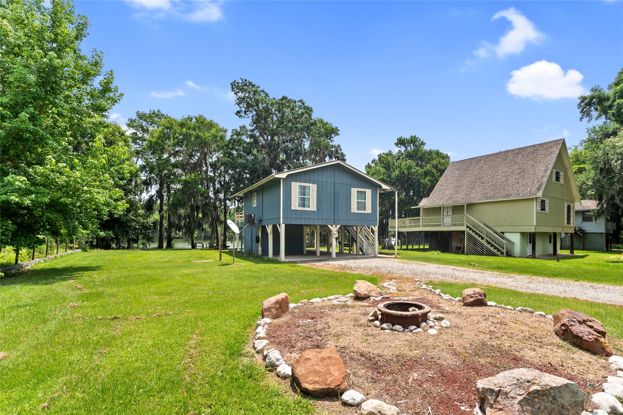 a front view of a house with a garden and yard