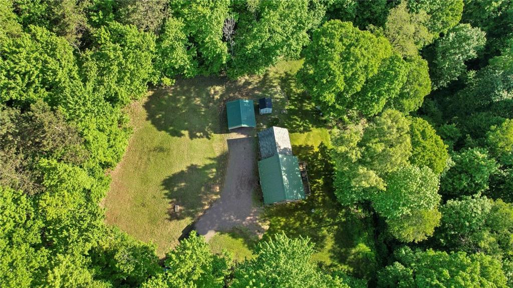 445 Taylor Road Markleysburg, PA 15459 - Photo 1 of 24 a view of a yard with plants and large trees