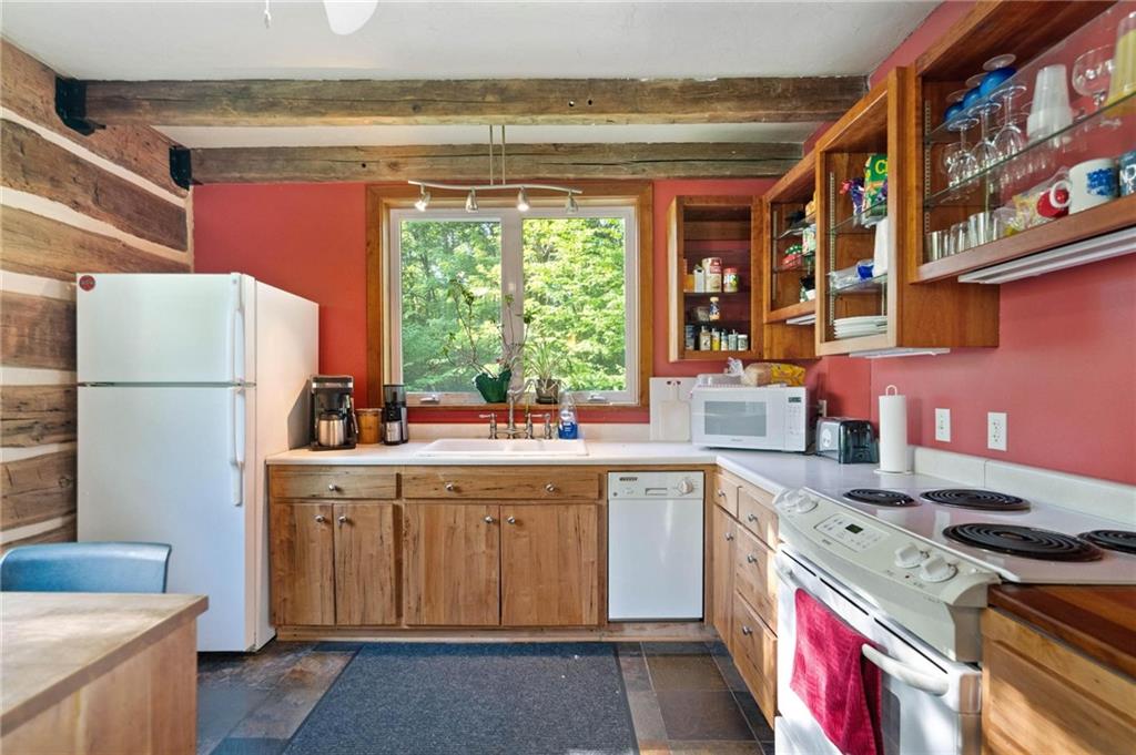 445 Taylor Road Markleysburg, PA 15459 - Photo 22 of 24 a kitchen with a sink stove and refrigerator