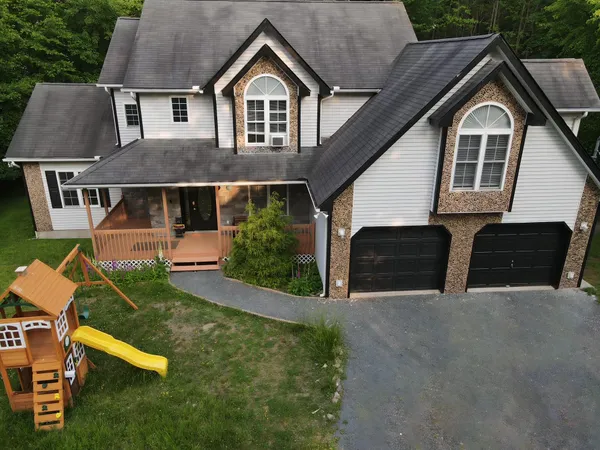 a front view of a house with a yard