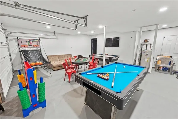a room with furniture and a flat screen tv