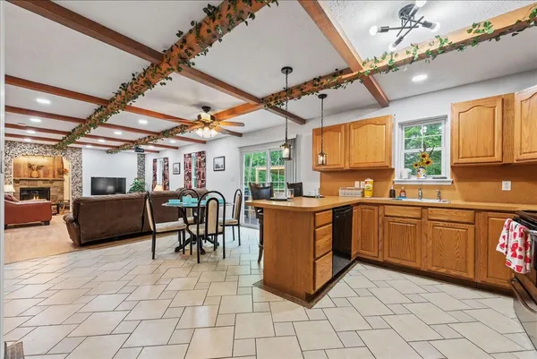a open kitchen with cabinets table and chairs