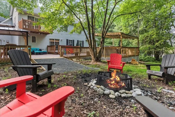 a backyard of a house with barbeque oven
