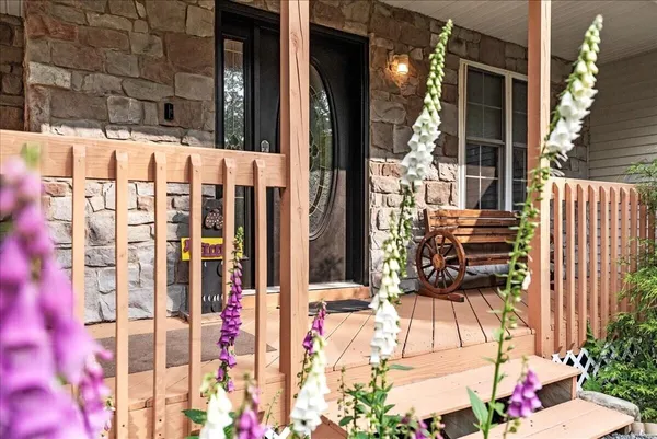 a view of deck with wooden floor and outdoor seating