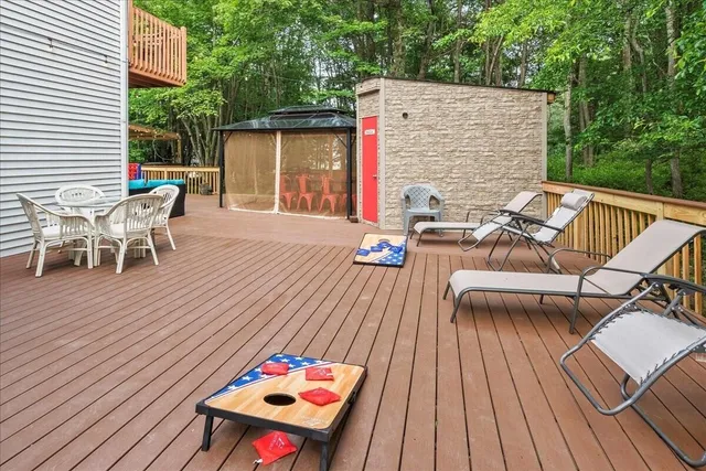 a bathroom with a bathtub a sink a vanity and a shower