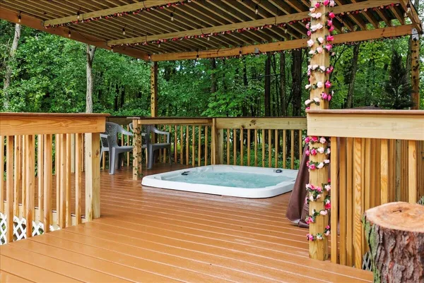 a view of a roof deck with wooden floor and outdoor seating