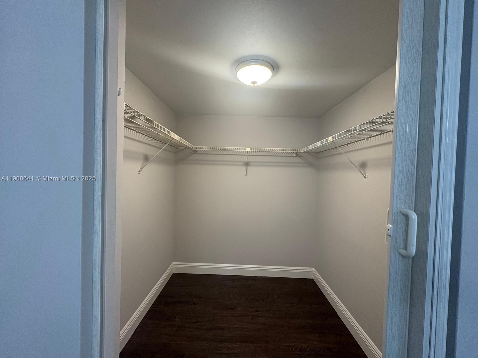 10288 Northwest 9th St Circle, Unit 307 Miami, FL 33172 - Photo 8 of 14 a view of a room with wooden floor