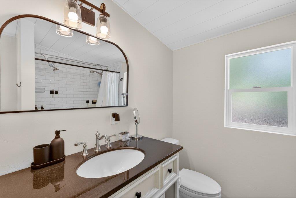 125 Shadowbrook Road Ben Lomond, CA 95005 - Photo 29 of 60 a bathroom with a granite countertop sink and a mirror