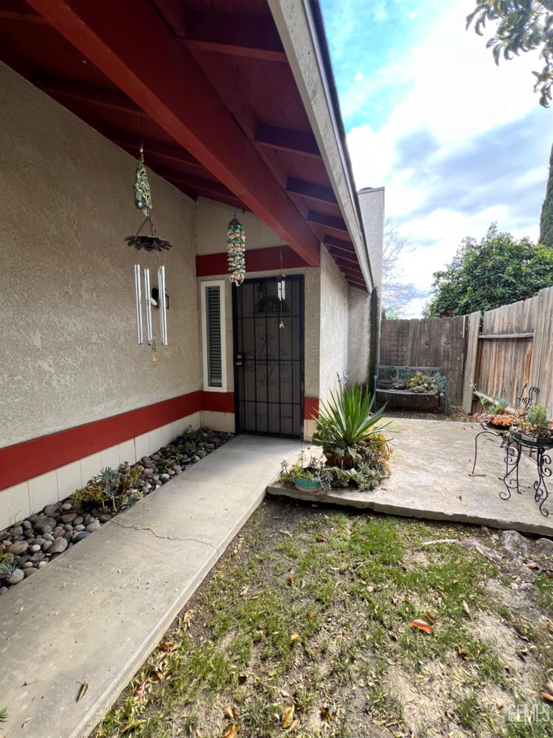 Undisclosed Address Bakersfield, CA 93307 - Photo 3 of 19 a view of a entryway door of the house