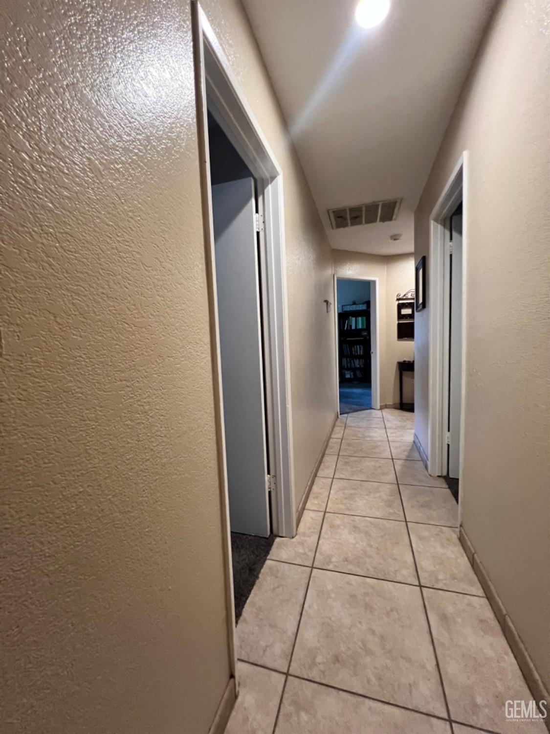 Undisclosed Address Bakersfield, CA 93307 - Photo 9 of 19 a view of a hallway