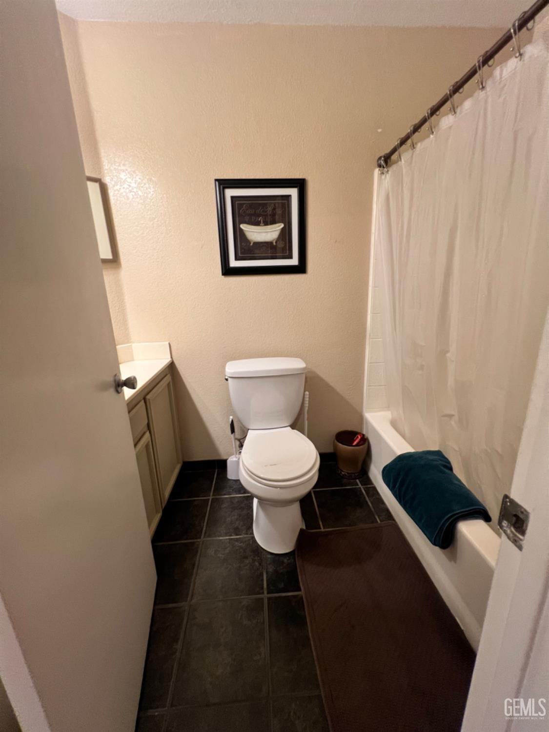 Undisclosed Address Bakersfield, CA 93307 - Photo 10 of 19 a bathroom with a toilet and a shower