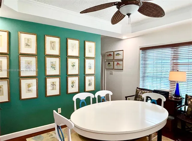 a view of a dining room with furniture and window