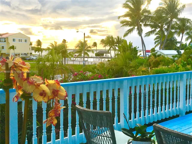 a view of a chair and table in the balcony