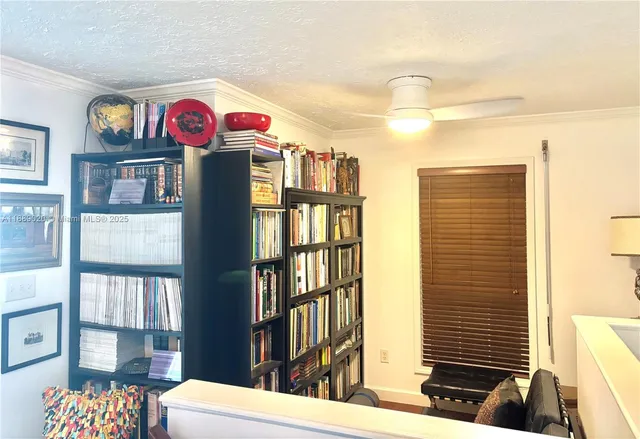 a view of livingroom with furniture and workspace