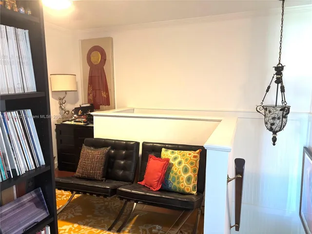 a bedroom with a bed and a night stand