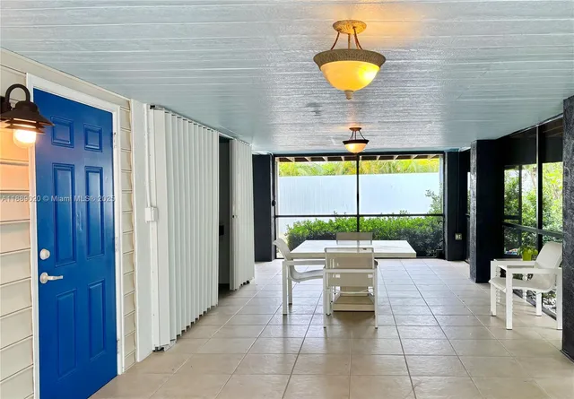 a view of ocean with a palm tree