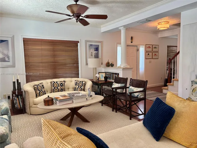 a living room with furniture or couch and a window