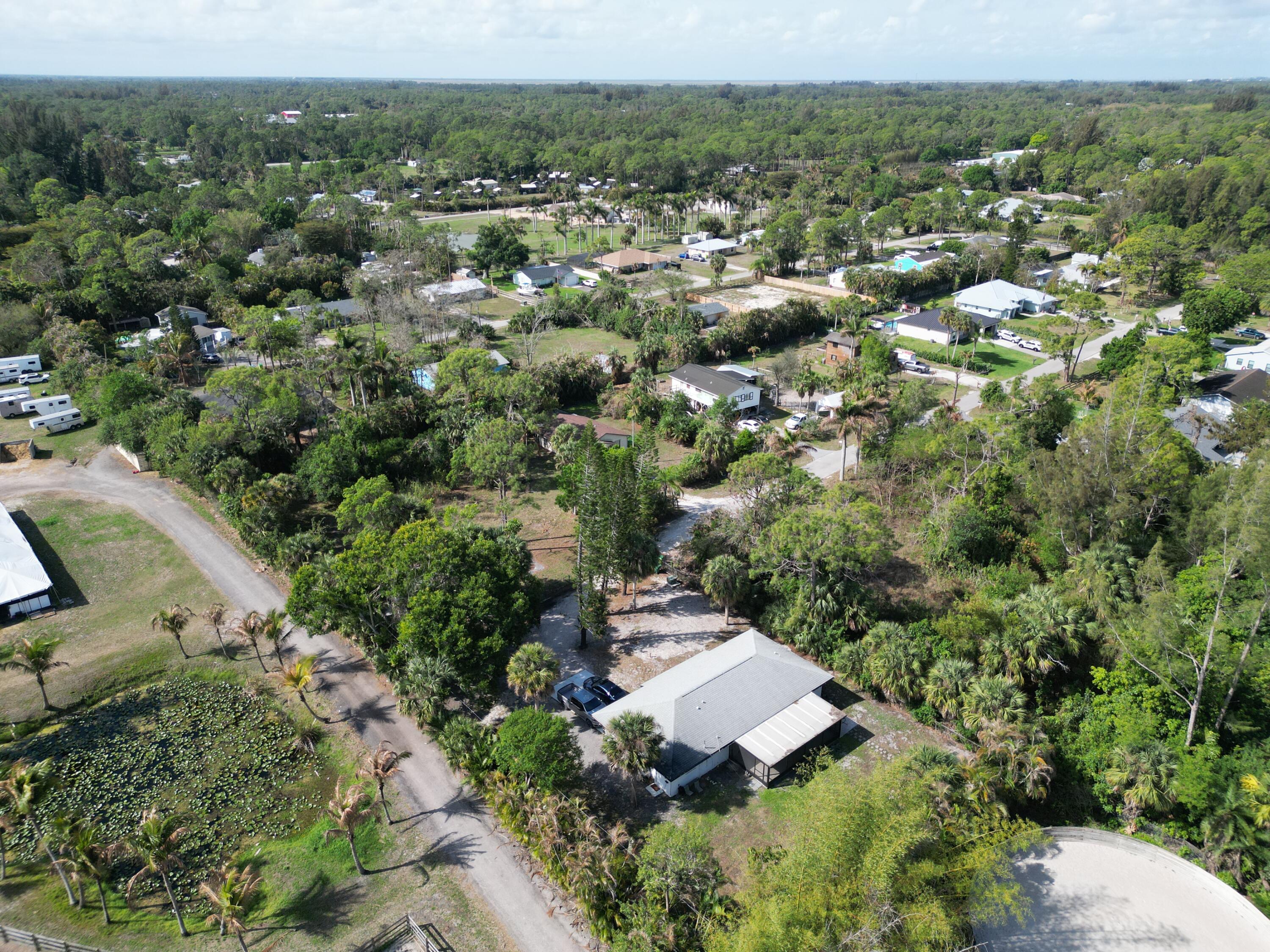 14523 Flamingo Road Loxahatchee Groves, FL 33470 - Photo 22 of 50 an aerial view of a house with yard