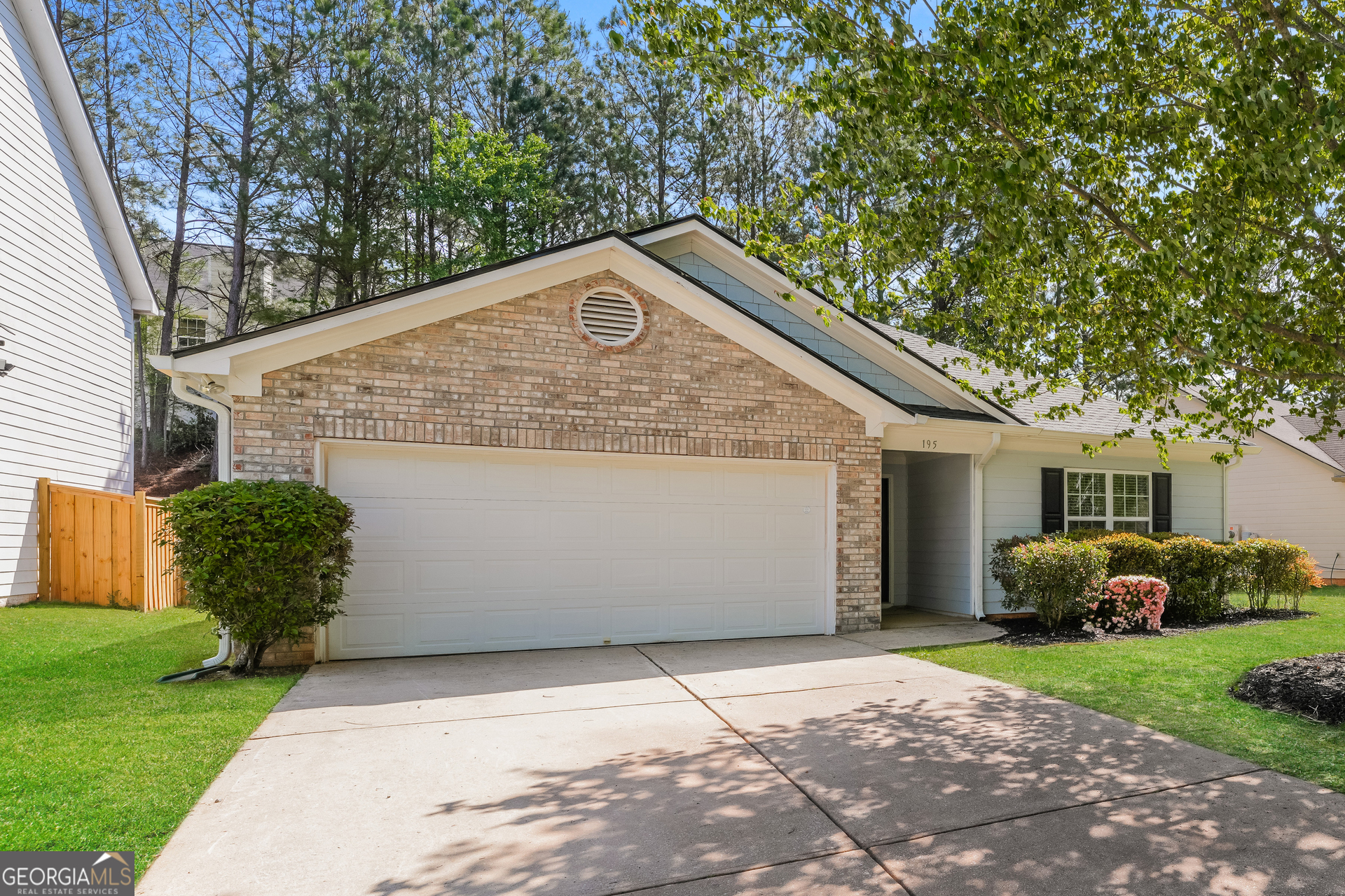195 Creek Way Covington, GA 30016 - Photo 1 of 1 a front view of a house with garden