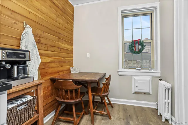 a view of a dining room with furniture and window