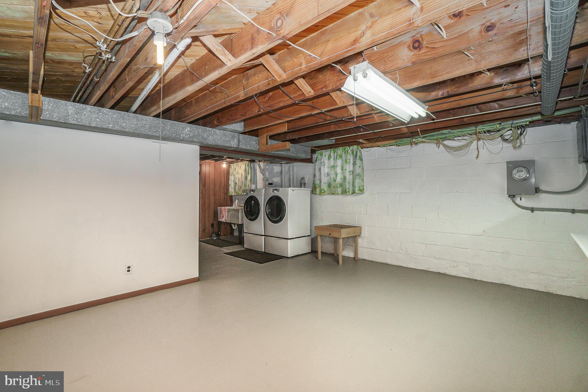 1905 Hillcrest Road Baltimore, MD 21207 - Photo 25 of 26 Unfinished basement with new washer and dryer
