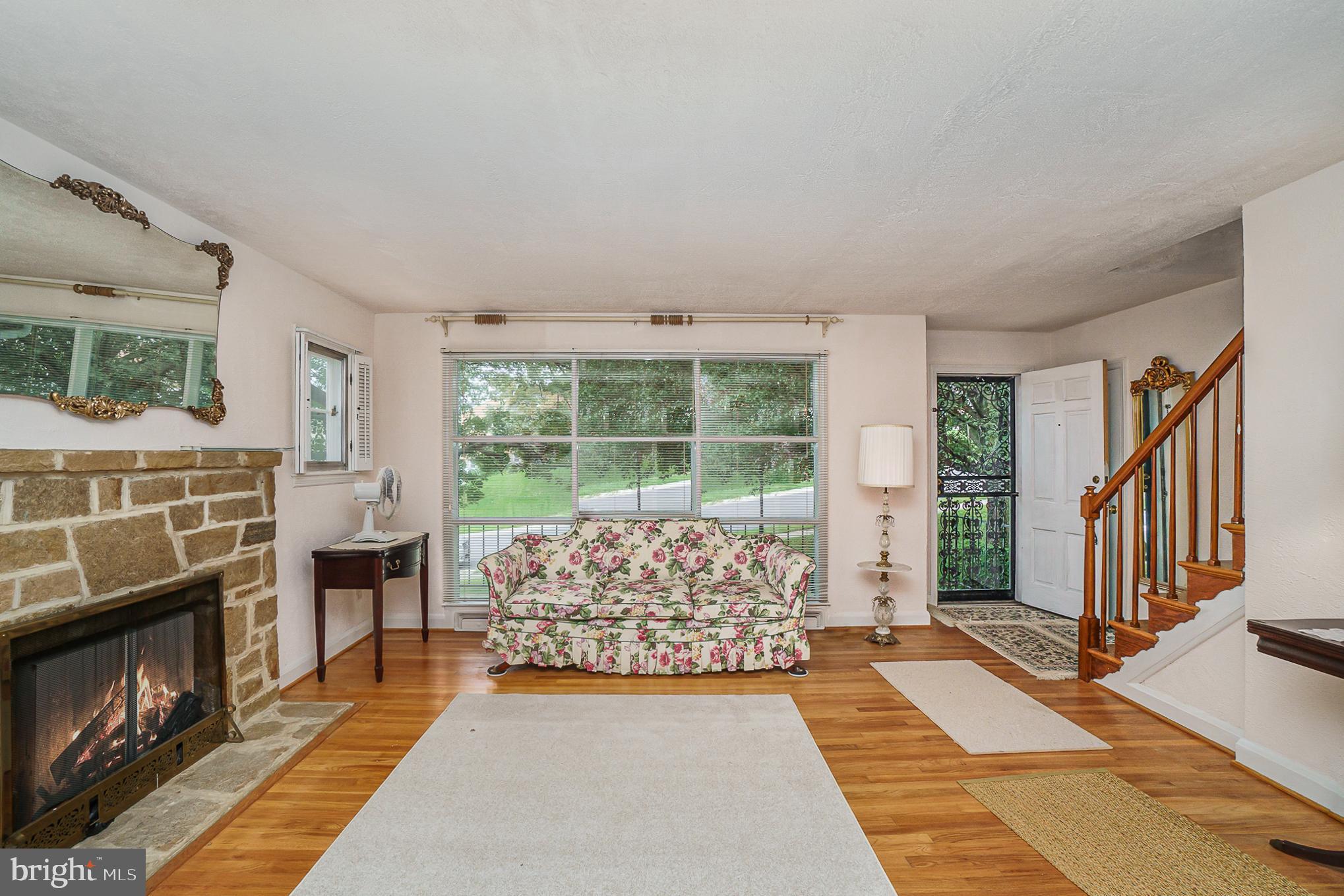 1905 Hillcrest Road Baltimore, MD 21207 - Photo 8 of 26 Fireplace and wood floors