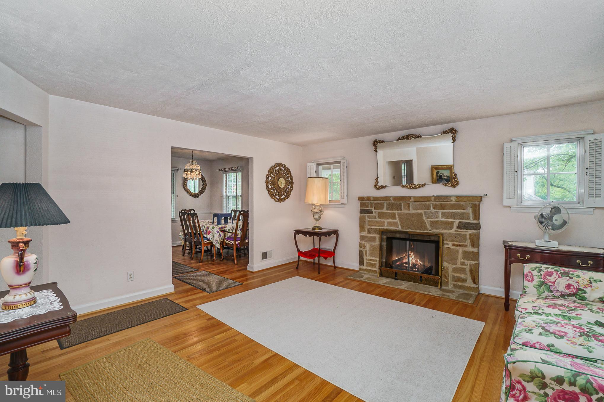 1905 Hillcrest Road Baltimore, MD 21207 - Photo 9 of 26 Living room with stone fireplace