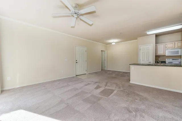 a view of a kitchen with a sink and cabinet