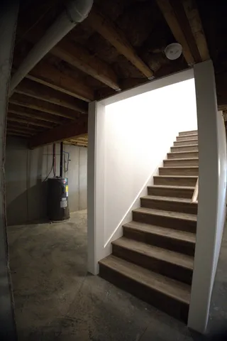 a view of an empty room with a fireplace