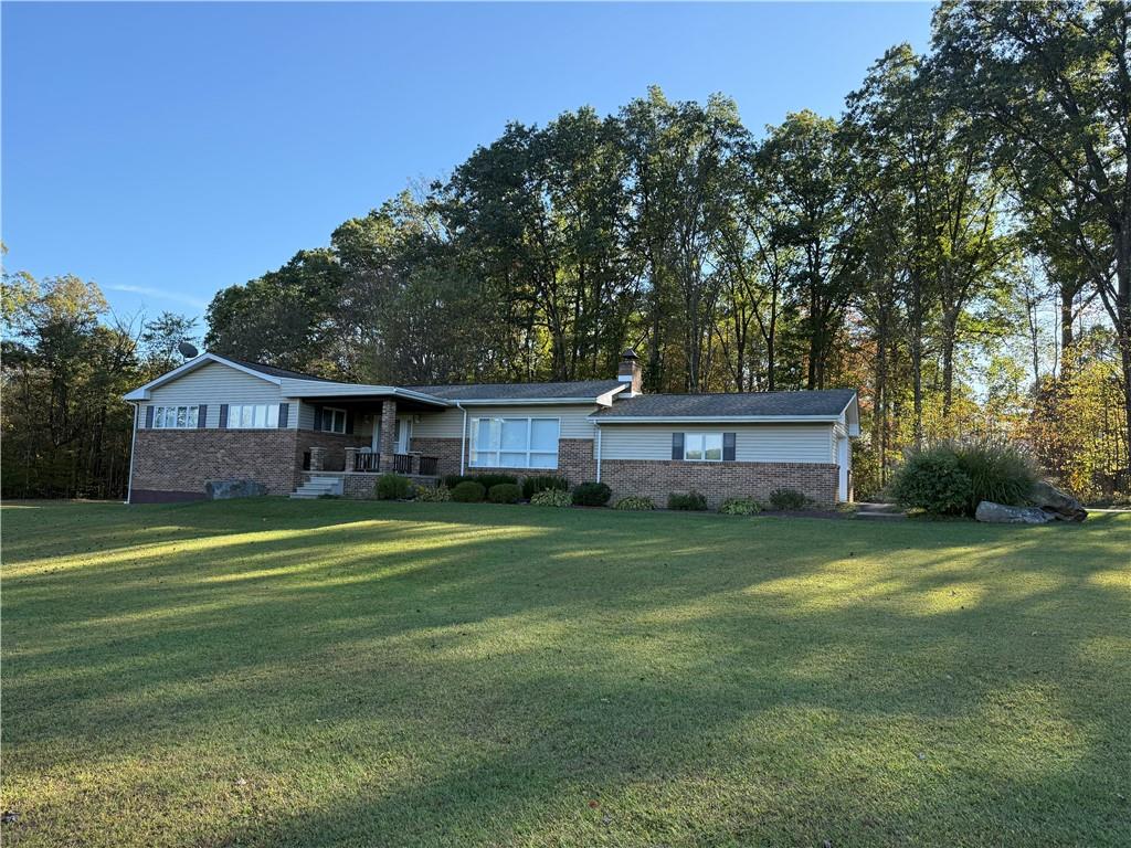 a view of a house with a yard