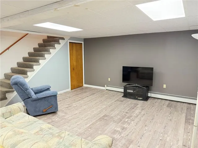 a bedroom with a bed and a television