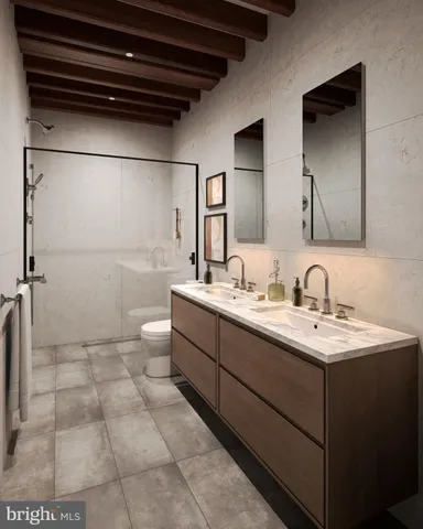 a bathroom with a sink a toilet and mirror