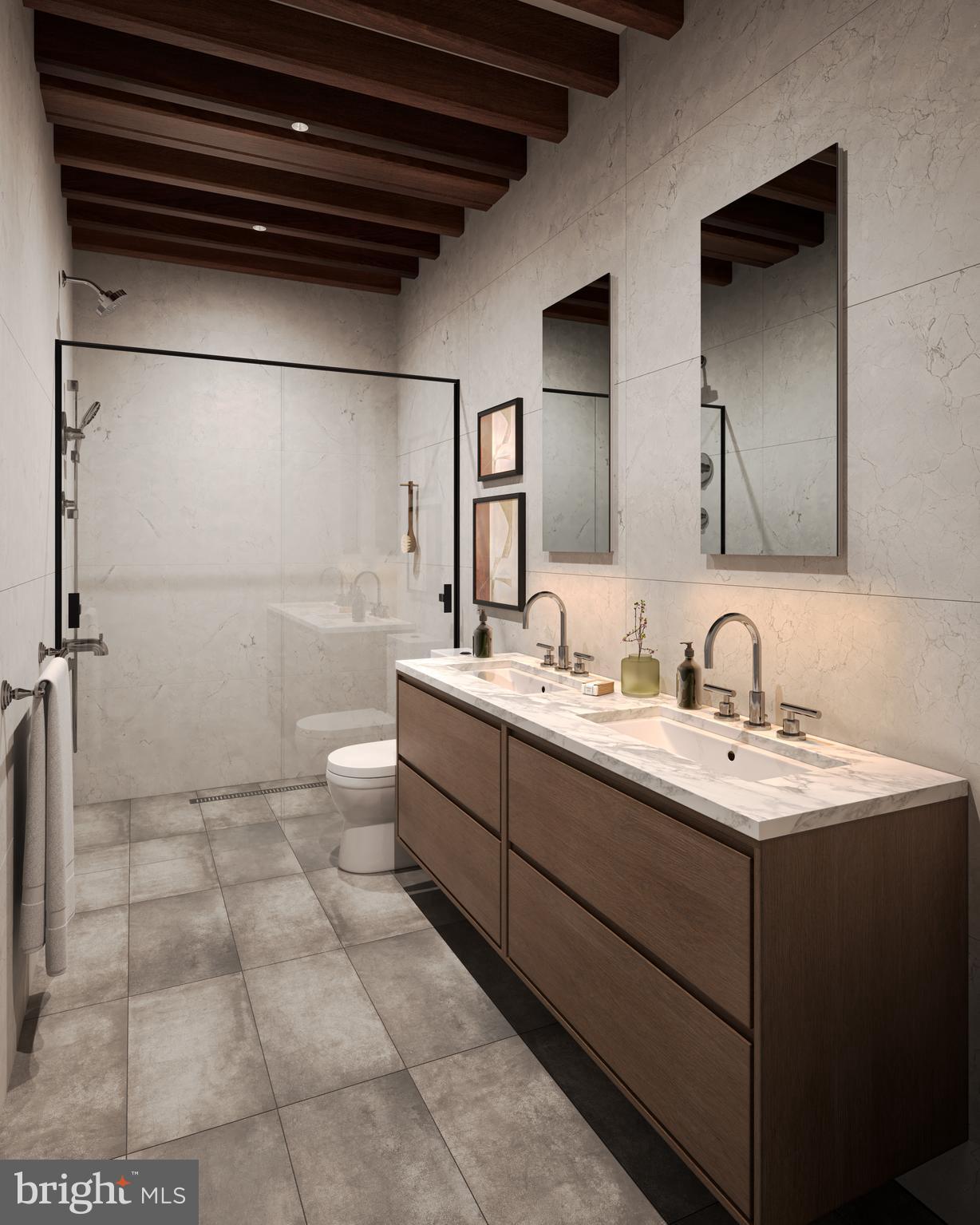 151 North 3rd Street Philadelphia, PA 19106 - Photo 3 of 6 a bathroom with a sink a toilet and mirror