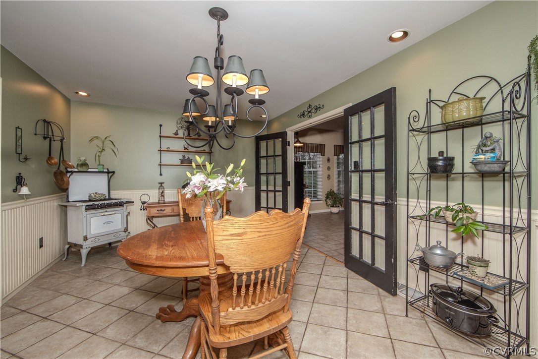 3601 Kiefer Road Chester, VA 23831 - Photo 28 of 46 a dining room with furniture a chandelier and window