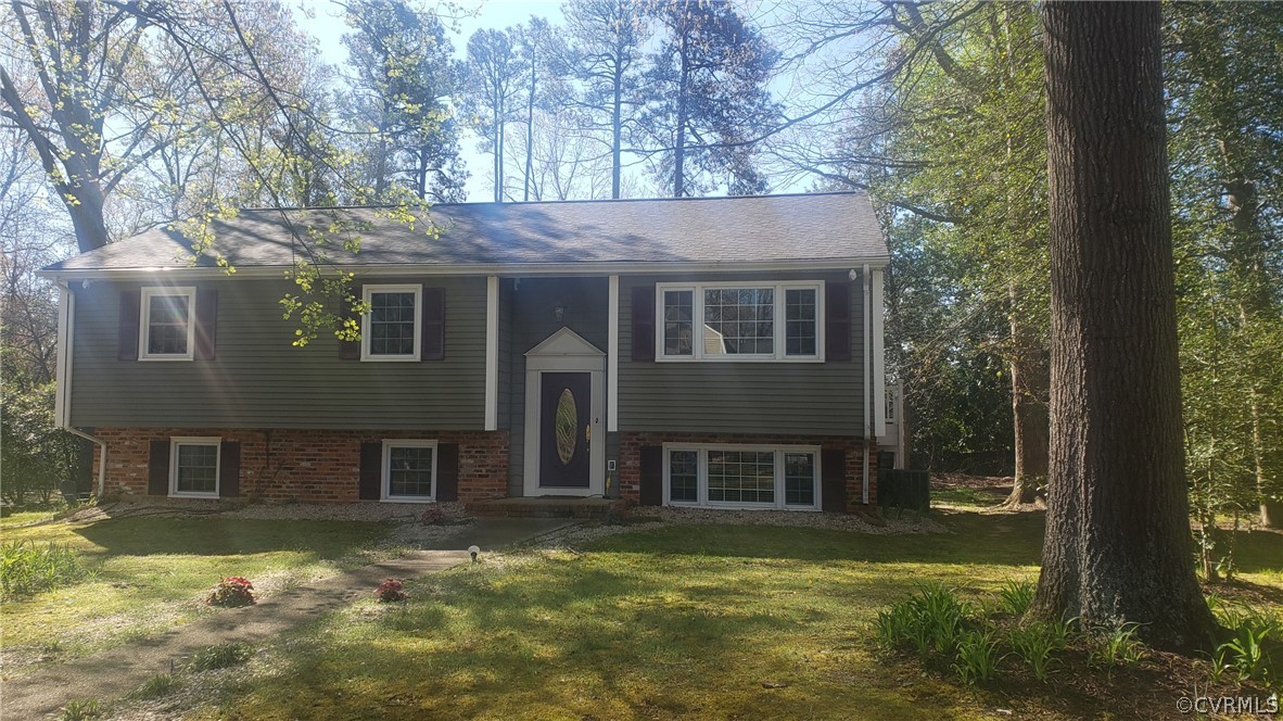 3601 Kiefer Road Chester, VA 23831 - Photo 3 of 46 a view of a brick house with a large windows and a yard