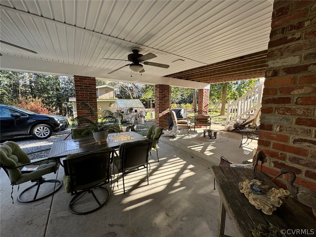 3601 Kiefer Road Chester, VA 23831 - Photo 5 of 46 a view of a patio with table and chairs and potted plants