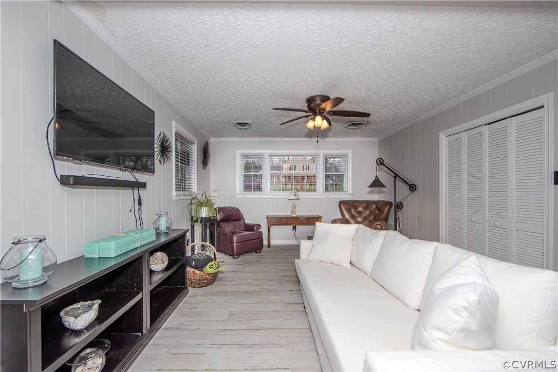 3601 Kiefer Road Chester, VA 23831 - Photo 9 of 46 a living room with furniture and a flat screen tv
